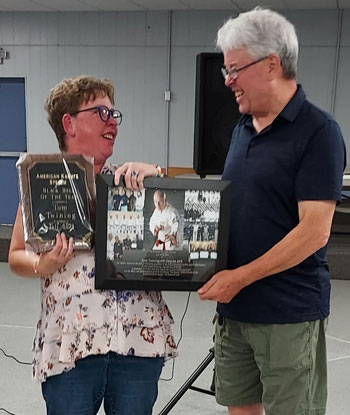 Tom's daughter, Jeran receiving his awards